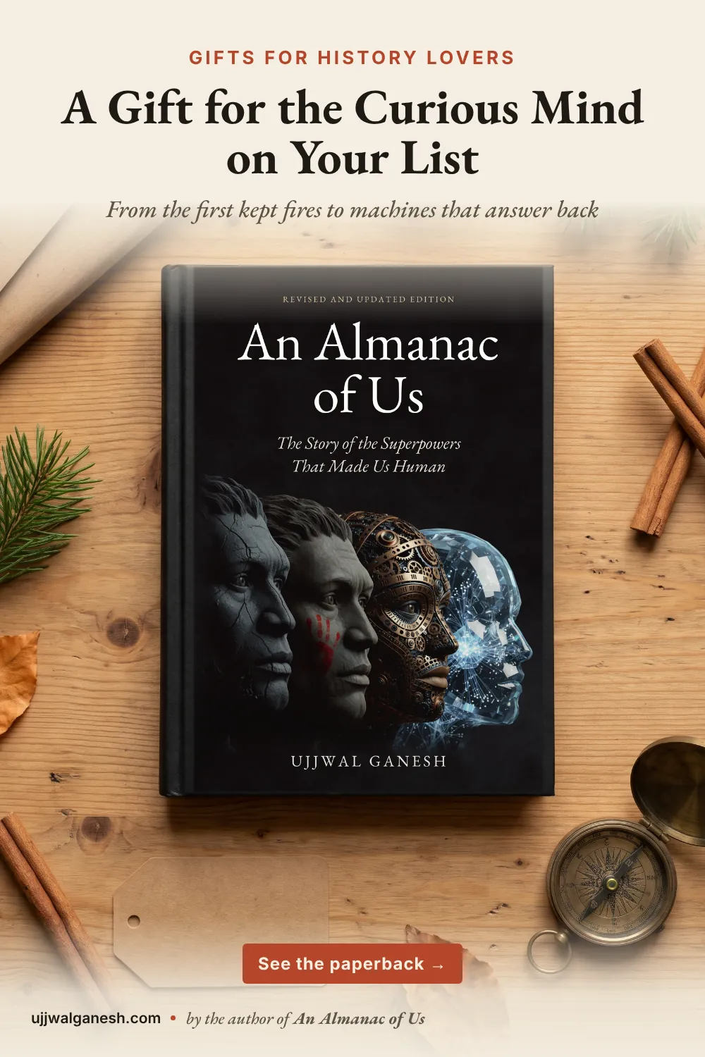 Flat-lay photo of the book An Almanac of Us by Ujjwal Ganesh on a wooden table with kraft gift wrap, red twine, pine sprigs, cinnamon sticks and a brass compass.